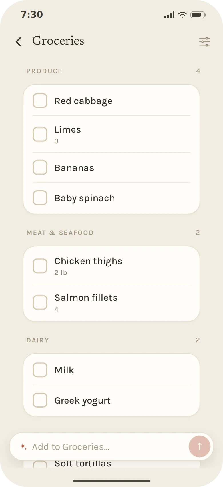 The Groceries list sorted by aisle: red cabbage, limes, bananas and baby spinach under Produce; chicken thighs and salmon fillets under Meat & seafood; milk and Greek yogurt under Dairy.